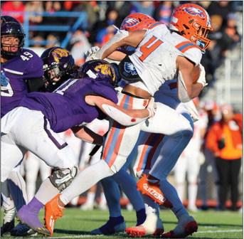 Canutillo running back LJ Martin (4) bursts through the Abilene Wylie defensive line during the Class 5A Division 2 Regionals Saturday at Panther Stadium in Fort Stockton. Photos by Shawn Yorks