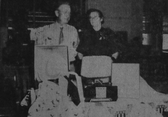 February 1955 … GIFTS MARK RETIREMENT – Mr. and Mrs. W.P. Rooney look with appreciation and pleasure at the array of gifts which were presented Mr. Rooney by friends and county officials to mark his retirement after 18 years as county auditor. Mrs. Rooney was given a corsage.