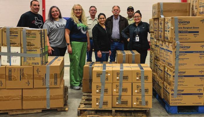 From left to right: Kevin Anderson, Connie Vega, Naomi Valenzuela, Cliff Harris, Roberta Garcia, Joe Shuster, Jessie Dominguez, Ethny Valenzuela. The group is pictured with the first strategic national stockpile brought to a warehouse in Fort Stockton in March of 2020. Courtesy Photo