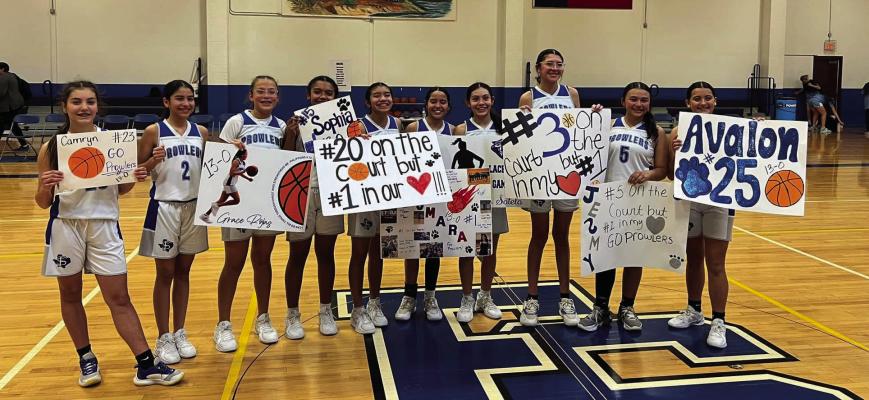 The 8th grade blue team cemented their legacy as one of the school’s best with a perfect 13-0 record this season, led by coach Humberto Renteria. Photo by Becky Rojas