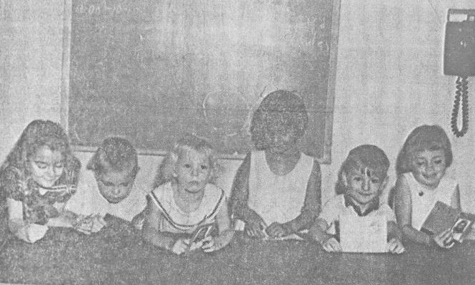June 1965 issue: KINDERGARTENS – Members of the kindergarten class of the Bible School held this past week at Faith Lutheran Church gaze down at their books and up at the camera. Students (left to right) include: Jacqui Higgins, Johnny Hundley, Susie Dillard, Brenda Gregory, Jimbo Higgins and Pam Taylor. Classes, which ran for a week, included classes in religion, prayer, and handicraft projects which illustrated the lessons.