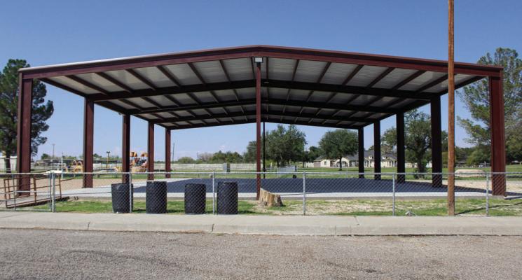 The newly constructed basketball pavilion at Gene Cummings Park in Fort Stockton is near completion. The metal pavilion and concrete floor were finished last month. The final piece that has yet to arrive is the basketball hoops, which will be placed east and west ends of the court. Fort Stockton EDC Director Remie Ramos said that the pavilion will likely be finished by the end of the month. Photo by Nathan Heuer