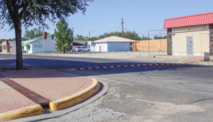 The speed bump in front of Heritage Funeral Home provides a means to slow traffic down before reaching the nearby Tiny Tots Daycare. Photo by Nathan Heuer