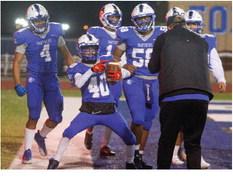 Fort Stockton’s Dylan Alvarado (40) celebrates his touchdown score with his teammates after a 37-yard run to end Friday’s contest against Pecos. Photo by Nathan Heuer