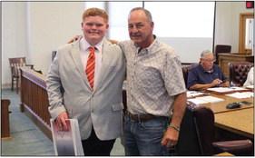 Samual Sparks pictured with Pct. 3 Commissioner Mickey Jack Perry after Spark’s presentation to the Commissioner’s Court about his experience in presenting his 4-H Congress Bill. Photo by Joh Covington
