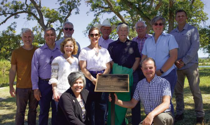 The Nature Conservancy in Texas Board of Trustees around the National Natural Landmark plaque. Photo by Anne Zuparko, TNC