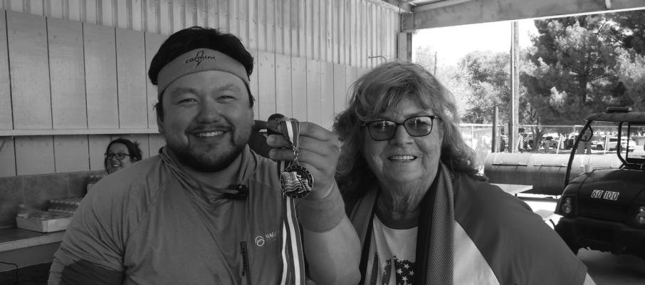 Hot Dog Eating Contest winner Samuel Pless poses with Fort Stockton Chamber Executive Director Arna McCorkle. Photo Courtesy of the Fort Stockton Rotary Club