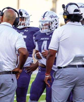 Fort Stockton players listen to head coach Xavier Rangel during a huddle in the Panthers’ Homecoming matchup against Levelland on Friday, Sept. 4, at Panther Stadium. Photo by Carla Vasquez/Tumbleweed+
