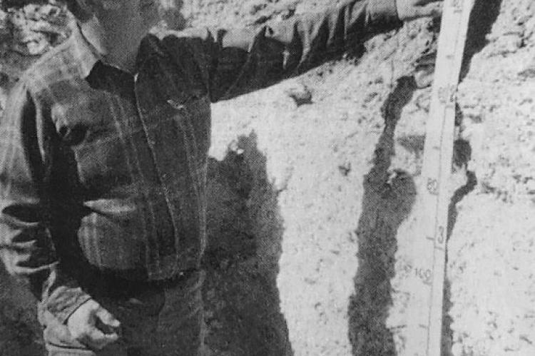 May 1999 - SOIL SURVEY MARKS CENTENNIAL - Jerry Rives of the Soil Survey’s Pecos office examines a soil profile in Terrell County. A monolith of that profile was selected for the centennial celebration. (Pioneer Photo)