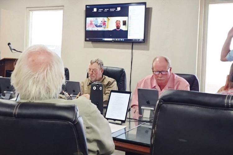 Pecos County Resident, Tommy Ezell and General Manager Ty Edwards during a sworn testimonial and protest of the water drilling permits during Tuesday, Oct. 20, Middle Pecos Groundwater Conservation District meeting. Photo by Pioneer