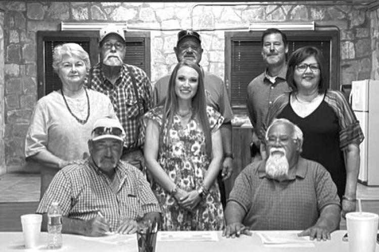 PLANNING AND FUNDING - Pictured are Dudley Mc Kissack, Board President; Billy Gonzales, General Manager. Standing are Rosalie Sullivan, Garry Edwards, Lea Daggett, board members; Kendra Burson, USDA; Andy Vecellio, Project Engineer; Sylvia Guerra, Office Manager. Courtesy Photo