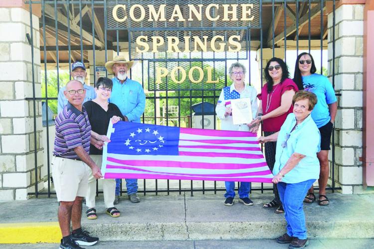 On Monday, the Pecos County Historical Commission presented the 250th Flag to Angela Lujan and assistants. The short ceremony took place in front of the Comanche Springs Entrance Gate on Spring Drive. Photo by Joh Covington