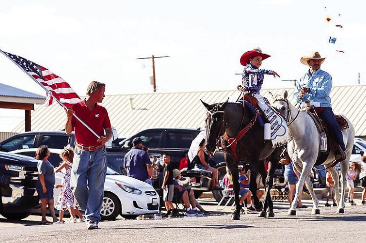 Miss Rodeo Comanche Springs Sweetheart 2023, Loretta Rivera, throws candy to paradegoers during Sunday’s 4th of July parade on Main Street. Photo by Shawn Yorks