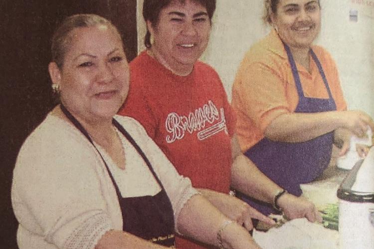 June 2006 - ENCHILADA LOVE – And enchilada dinner helps fund citizenship applicants. Cooks working on the enchilada luncheon, Norma Lujan, Lupita Sanchez, and Griselda Armendariz are pictured making the salad and side dishes. (Pioneer Photo)