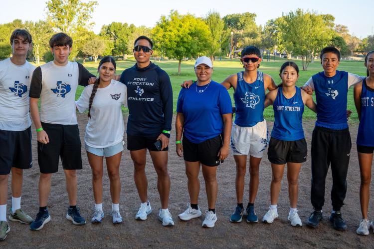 Fort Stockton High School cross country runners gather in front of a memorial honoring former teammate Eddie Vela during the inaugural Eddie Vela Memorial 5K on Saturday at Rooney Park. Vela, a Panther sophomore and varsity cross country runner, was remembered by family, friends, classmates and teammates during the event, which raised funds for student grief support and safe driving awareness. Courtesy Photo