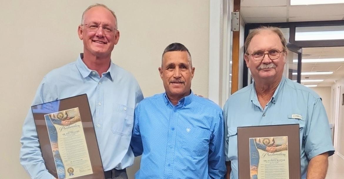 Mayor Paul Casias presented a proclamation recognizing Jeff Williams, left, and Patrick Blisnak, right, for their assistance and generosity during the situation. Courtesy Photo: Pioneer