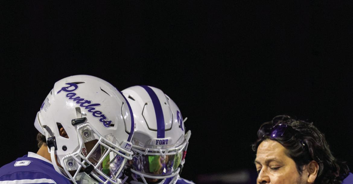 Fort Stockton’s Derek Garcia and Ayden Hernandez review plays with Coach Manuel Espino. Photo by Ayden Chavez, Tumbleweed+